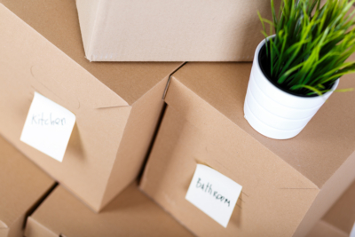 Pile Of Brown Cardboard Boxes With House Or Office Goods